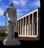 La statua di Fausto Melotti si redimono i campi vista dal retro e sullo sfondo il palazzo uffici